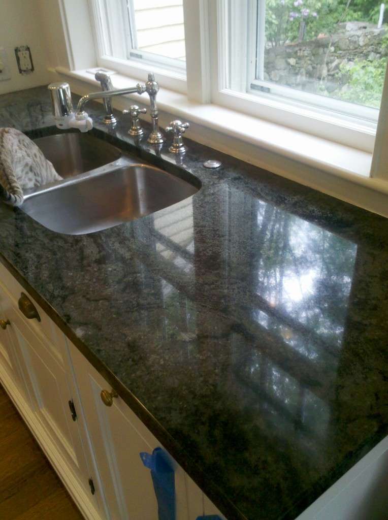 Green granite counters after polish sun view with cat in sink