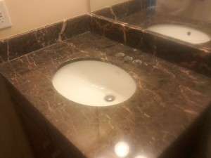 Emperador Brown marble vanity overall after polish shiny