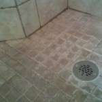 sanded grout shower floor close view before regrout