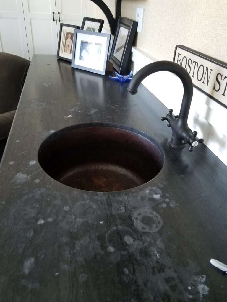 Stone countertop with etches